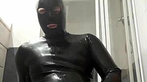 latex guy wanks in suggestive gay scene.
