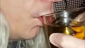 Blindfolded bisexual crossdresser fed pee by girlfriend