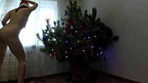 Petite girl dancing around the christmas tree. 🎄💃