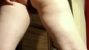 busty camgirl in grey teases with ass play