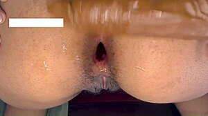 teen slut's tight ass stretched by huge dildo in close-up