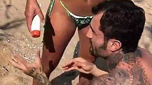 Wife films lesbian on beach.