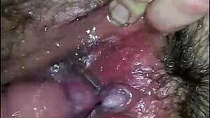 he enjoys touching and exploring her close-up hairy pussy in homemade video