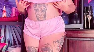 Curvy babe teasing in silk pajamas