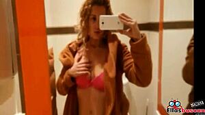 Blonde woman in public bathroom looking for company