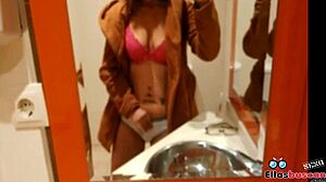 Blonde woman in public bathroom looking for company