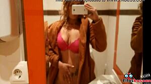 Blonde woman in public bathroom looking for company