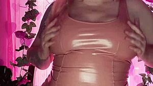 Model Teases in Shiny Latex Dress for Fashion Display