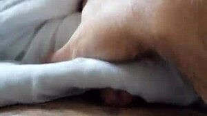 Intriguing solo masturbation in bed, hands exploring body with teasing touches
