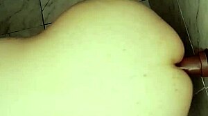 brunette fixes console stuck on wall