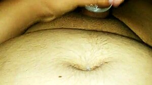 Gay man cums inside the condom during intense session