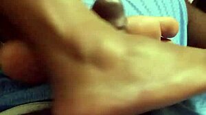 Wife gives intriguing footjob to husband in bedroom scene