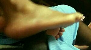 Wife gives intriguing footjob to husband in bedroom scene