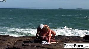 Busty blonde Tarra takes white and black cocks