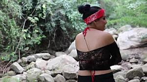 Amateur couple enjoys outdoor oral and banging by the river, ignoring onlookers.