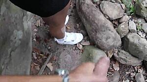 Amateur couple enjoys outdoor oral and banging by the river, ignoring onlookers.