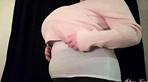 undressing footage reveals curvy brunette in tight bra