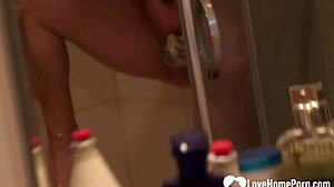 Blonde beauty pleasures herself in the shower