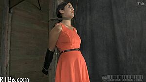 The babe hangs upside down and gives an amazing blow job.