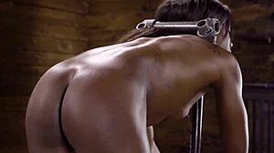 Slim ebony whipped in bondage device
