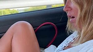 Amateur masturbates outdoors in car while fingering