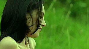 Brunette Sade Mare teases sensually outdoors with natural tits.