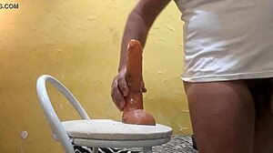 Watch him cum hard with the dildo in this gay scene!