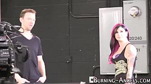 Goth slut poses in lingerie backstage