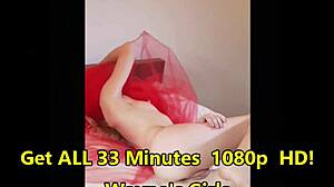 Odette cavorts on red bed playing with petite blonde pussy and natural tits