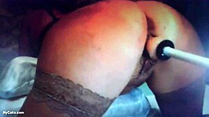 Milf with big ass squirts during machine fucking.