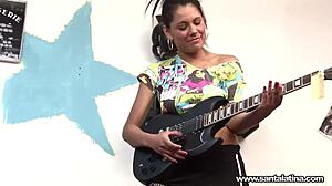 Horny Latina Santa Abril Excels at Pleasuring Vaginas and Penises Despite Guitar Struggles
