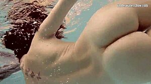 Loris Licicia shows off her petite figure in a hot underwater naked swim