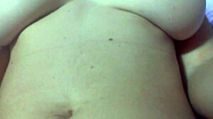 In the bedroom, she masturbates her shaved pussy with toys until a cumshot