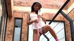 Brunette carina strips clothes on balcony outdoor