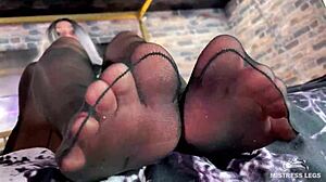 Hey, look at this goddess teasing with cute black pantyhose on her feet!