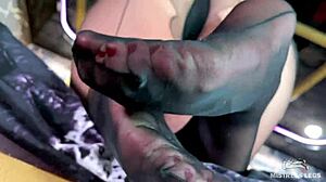 Hey, look at this goddess teasing with cute black pantyhose on her feet!