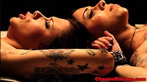 Mistress dominates her submissives in a lesbian bdsm session