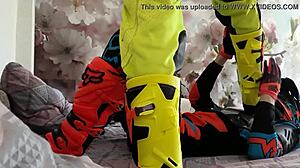 Motocross Rider In Costume Treads Boots In Gay Scene