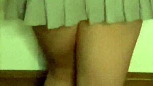 Petite European Babe Teases in Mini Skirt and Leather Boots