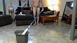 Horny gay nudist cleans house barefoot on beach while masturbating with anal toys