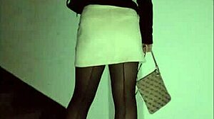 Leather catsuit or pantyhose with miniskirt