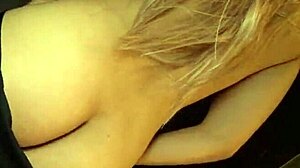 A big-tits blonde milf performs an oiled striptease before masturbating in the shower