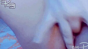 Hey, check out this amateur Asian fingering her pussy up close. So hot!