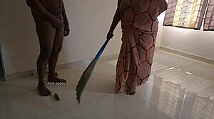 Tamil maid Prabha strokes owner's cock during her daily chores.