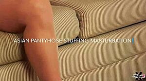 Oriental cougar Maxine X fucks her cunt with heels.