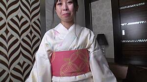 Bathrobe-Clad Mature Woman Engages in Intimate Encounter