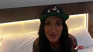 tattooed bombshell adel asanti in an erotic pov scene with toys and piercings.