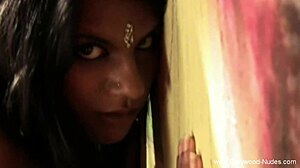 sexy brunette strips naked, teasing by the warm fire