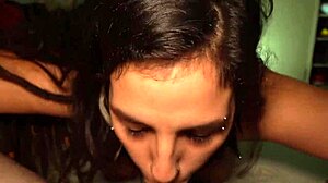 Latina sucks boyfriend's cock and jerks him off to cumshot.