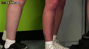 clothed cheerleader gets handjob from femdom group in locker room